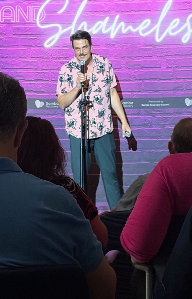 J. Steinbrunner performing with props during the Sober and Shameless comedy show